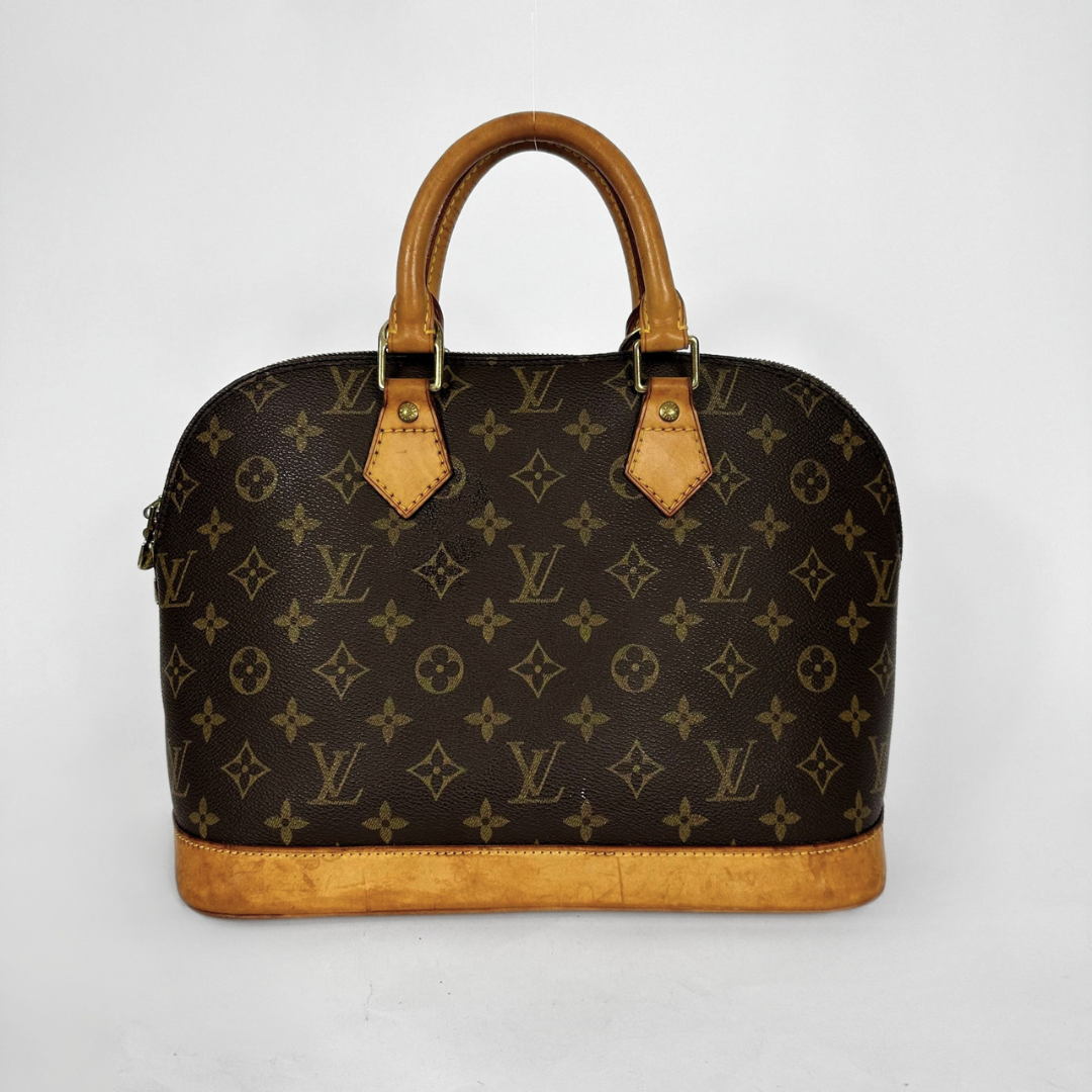 Louis Vuitton monogram canvas dome handbag with tan leather handles and trim, photographed against a plain light gray background.