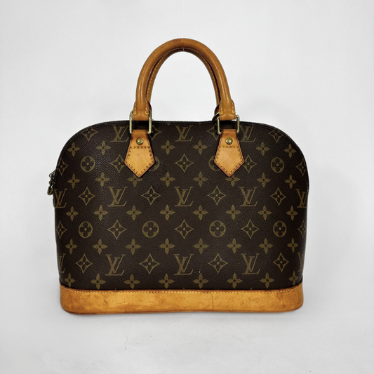 Louis Vuitton monogram canvas dome handbag with tan leather handles and trim, photographed against a plain light gray background.