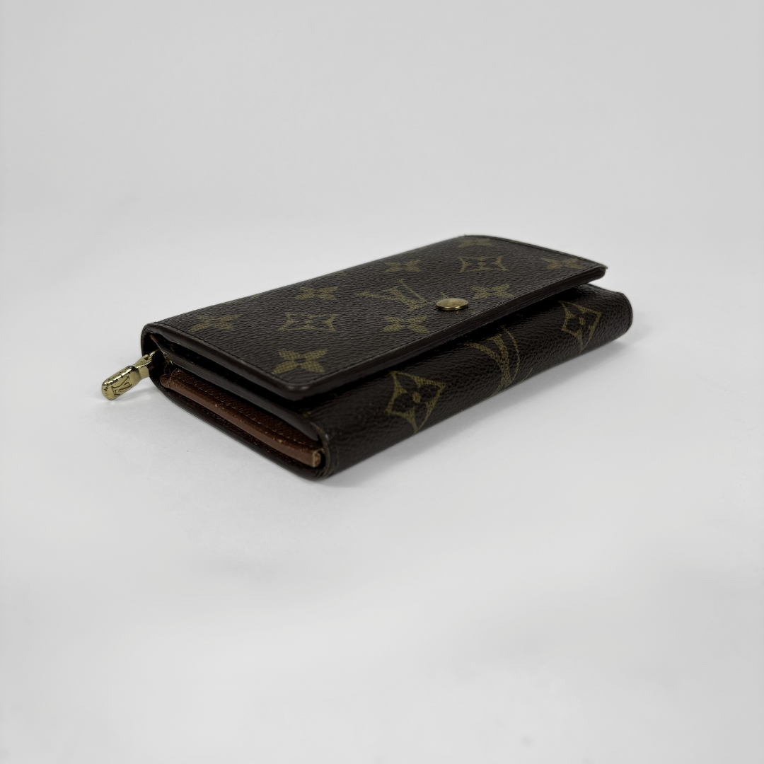Louis Vuitton wallet in a white background