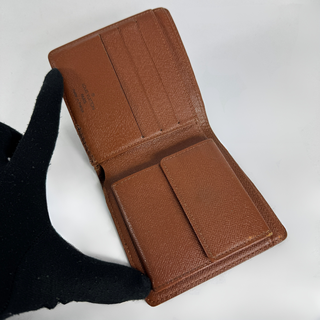 Louis Vuitton Flap Wallet on a white background