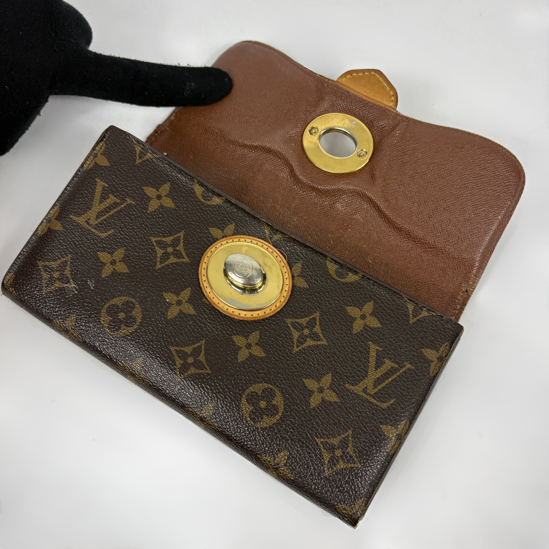 Louis Vuitton Wallet in front of white background