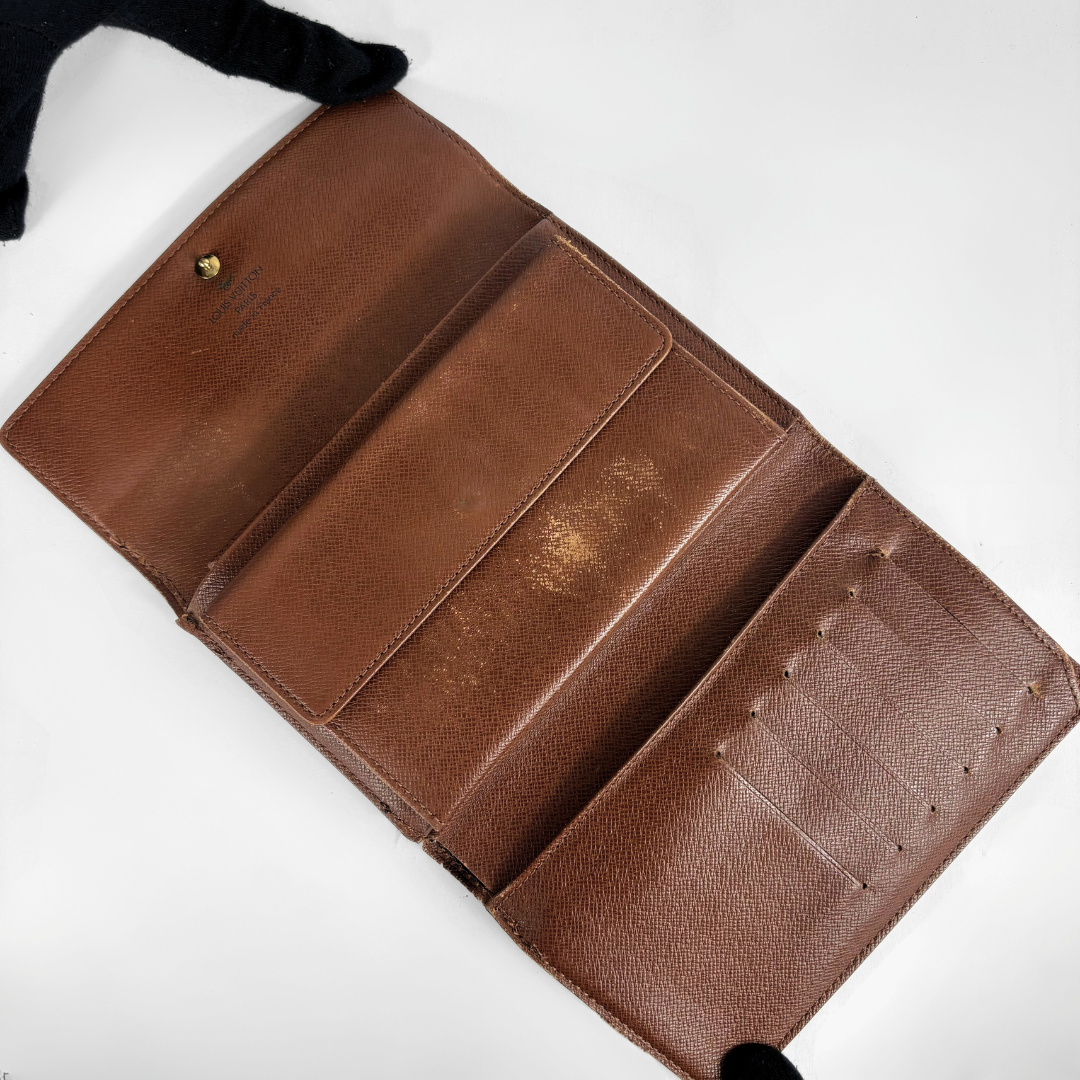 Louis Vuitton International Wallet Medium on a white background