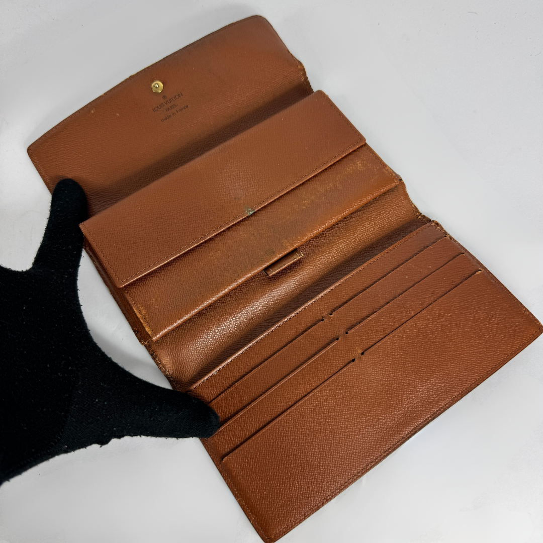Louis Vuitton Wallet International on a white background