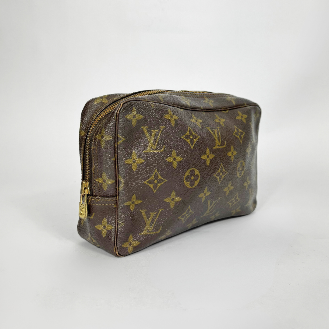Brown Louis Vuitton monogram bag on a white background