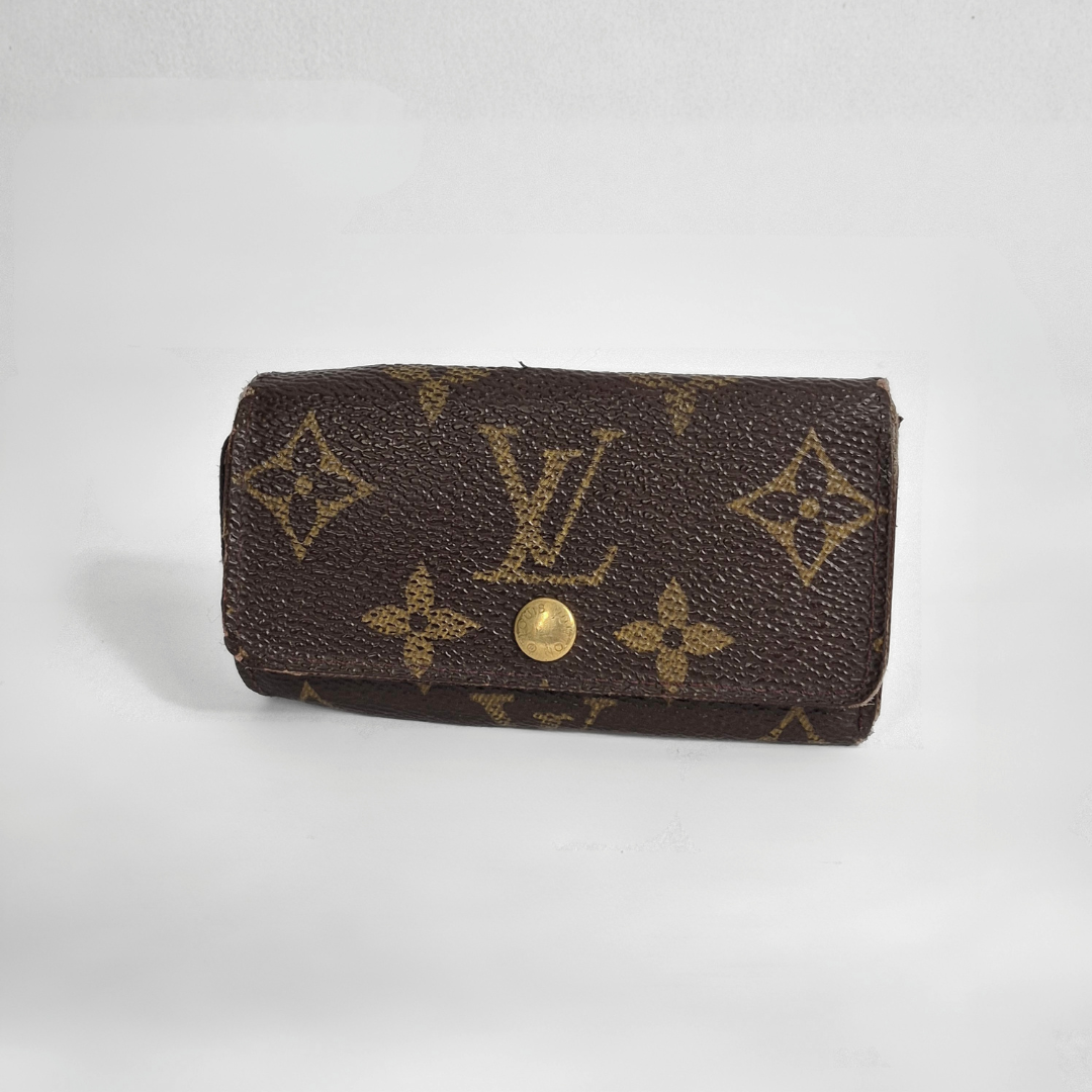 Louis Vuitton wallet with monogram pattern on white background