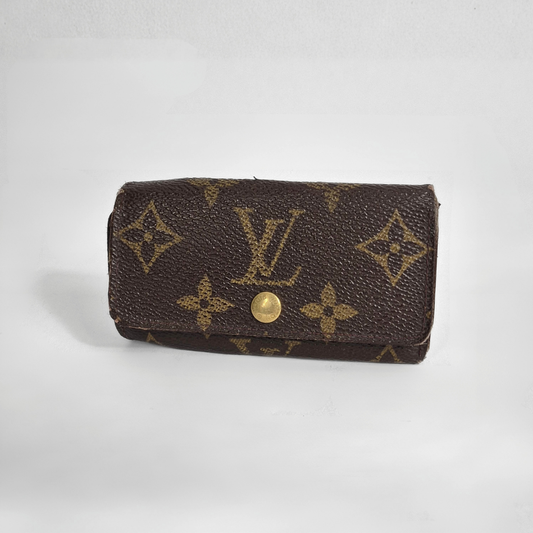Louis Vuitton wallet with monogram pattern on white background