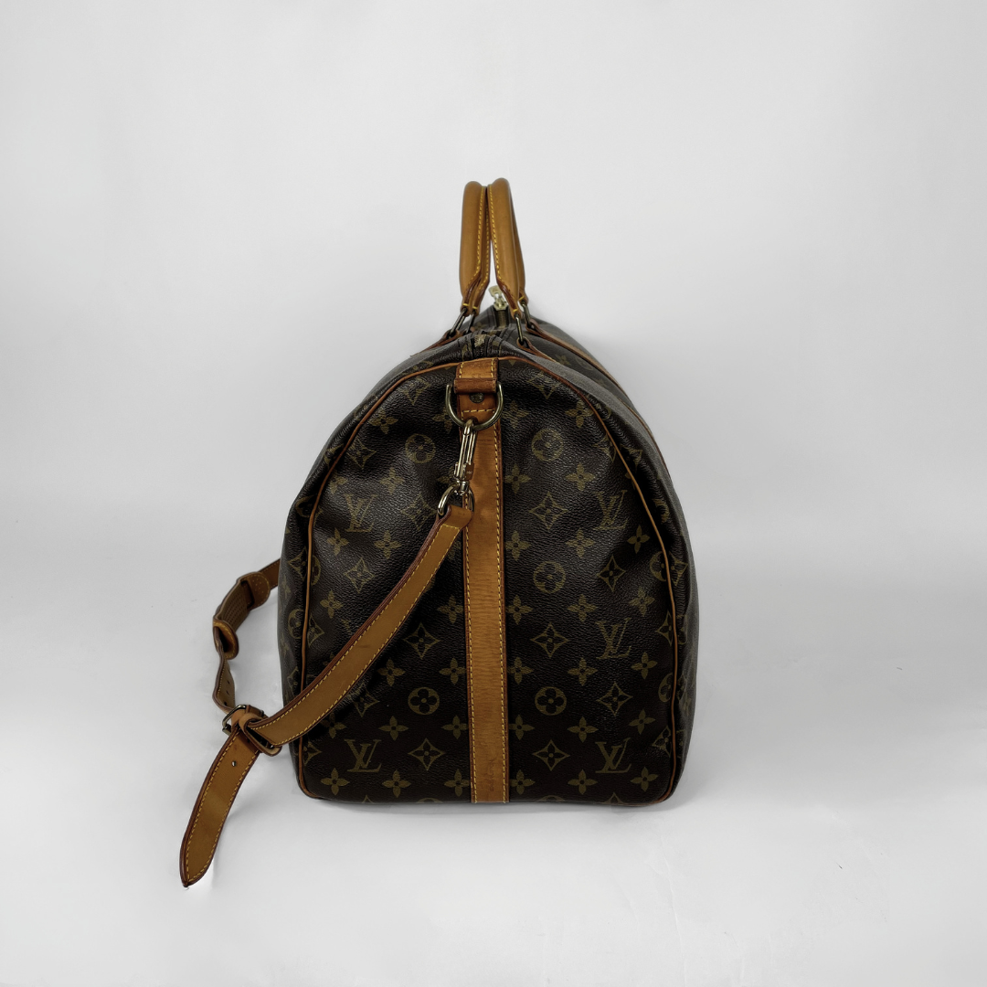 Louis Vuitton Keepall Strap 55 on a white background