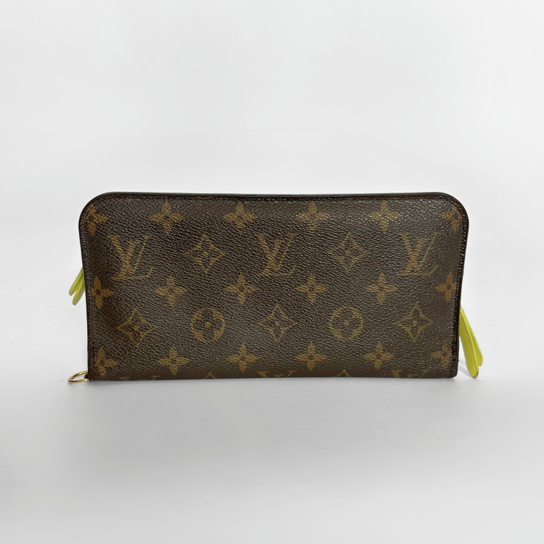 Louis Vuitton wallet with monogram pattern on a white background