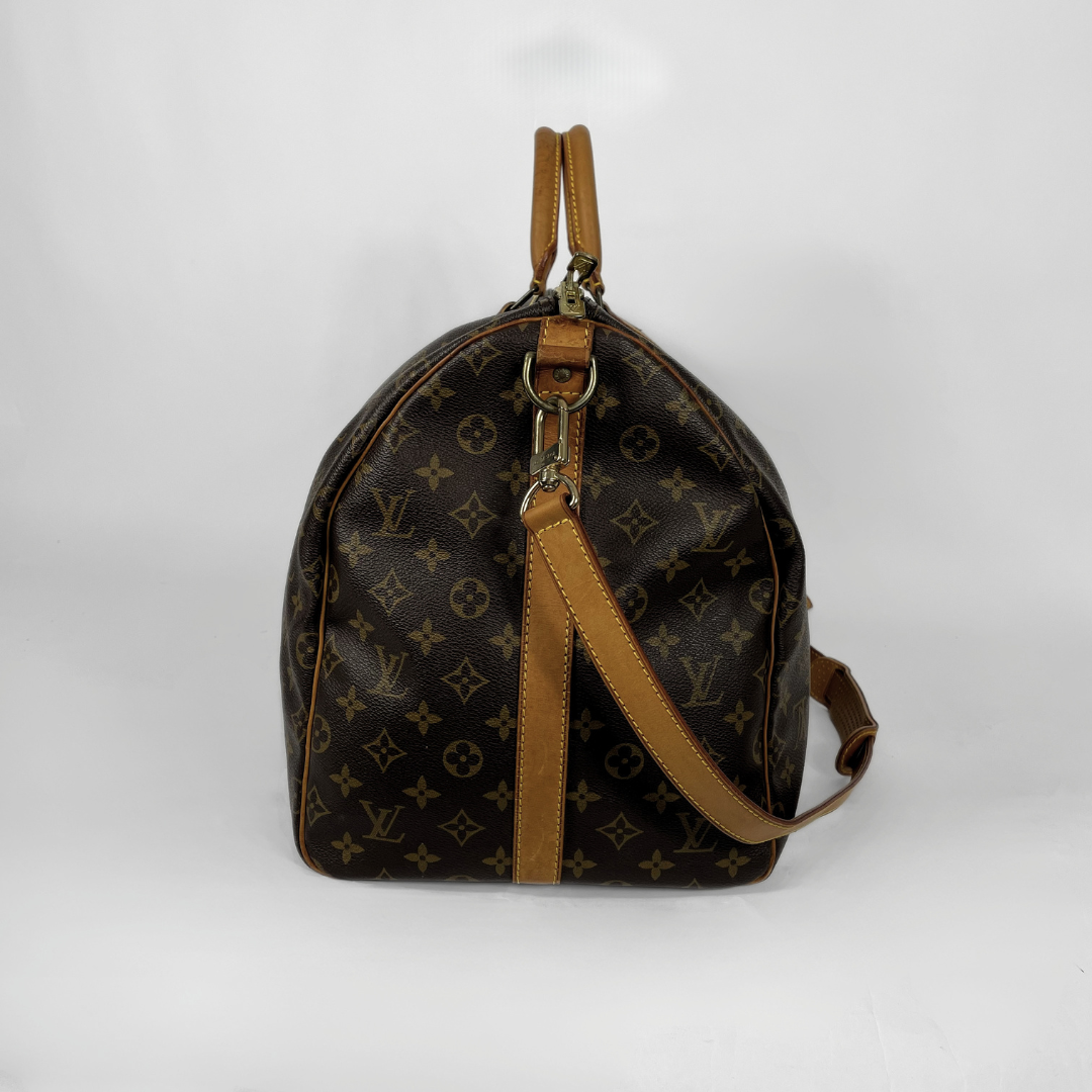 Louis Vuitton Keepall Strap 55 on a white background