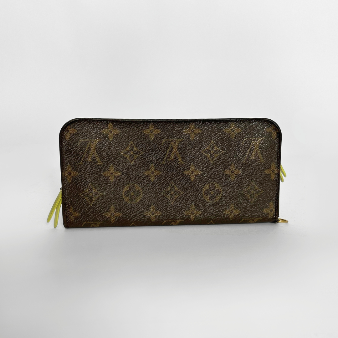 Brown wallet with monogram pattern on a white background