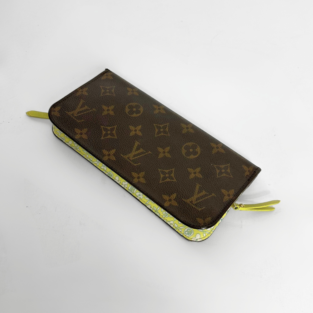 Designer wallet with monogram pattern on a white background