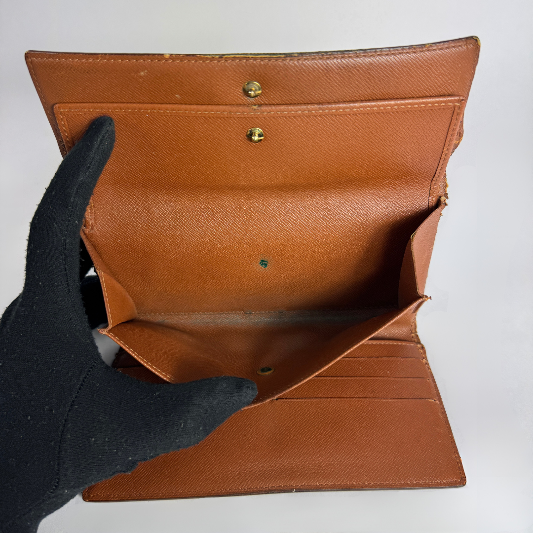Louis Vuitton Wallet International on a white background