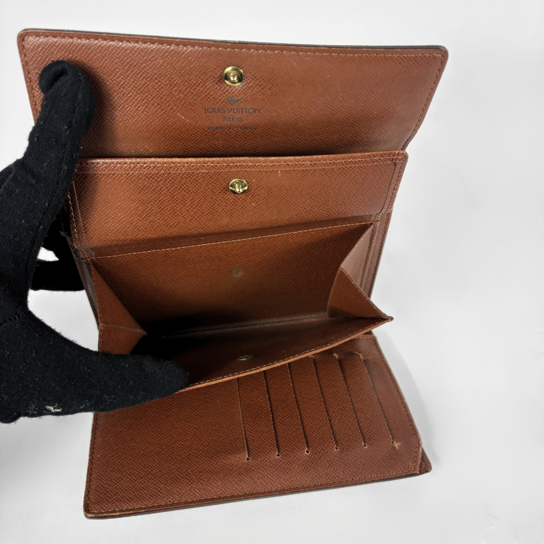 Louis Vuitton International Wallet Medium on a white background