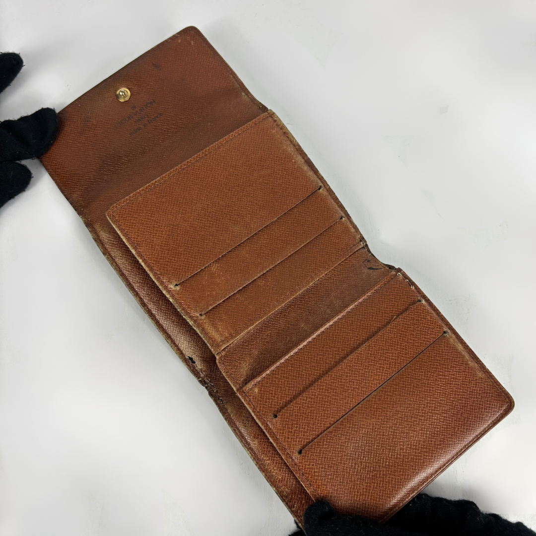 Louis Vuitton Druk Wallet on a white background