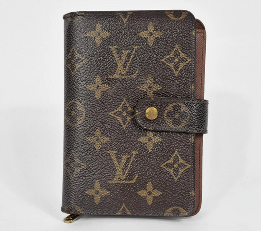 Brown wallet with monogram pattern on a white background