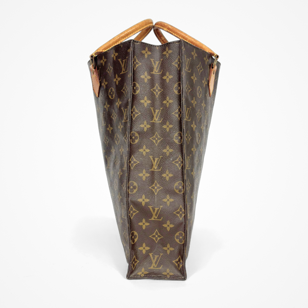 Louis Vuitton monogram handbag on a white background